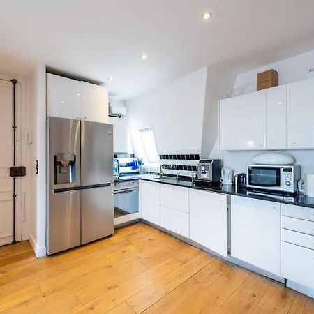 Appartement Vue Tour Eiffel ปารีส ภายนอก รูปภาพ